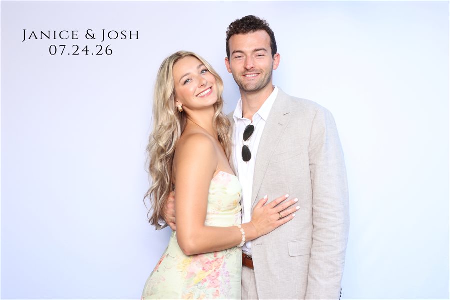 Guests posing together at Janice and Josh's wedding photo booth