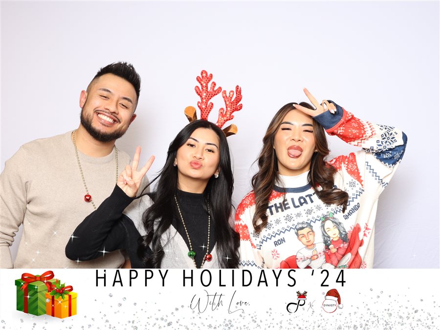 Coworkers posing together at the Infinite X Dynasty holiday party photo booth