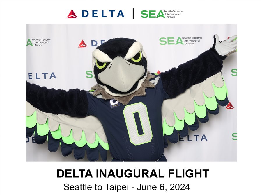 Seahawks mascot at the Delta Air Lines inaugural flight celebration at Sea-Tac Airport